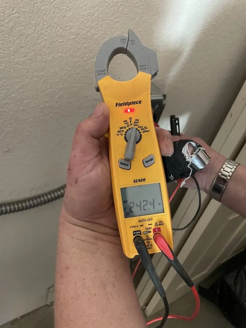 Voltage testing with clamp meter during Electrical Installation Services in Fort Mill